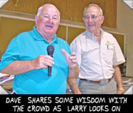 DAVE  SHARES SOME WISDOM WITH THE CROWD AS  LARRY LOOKS ON